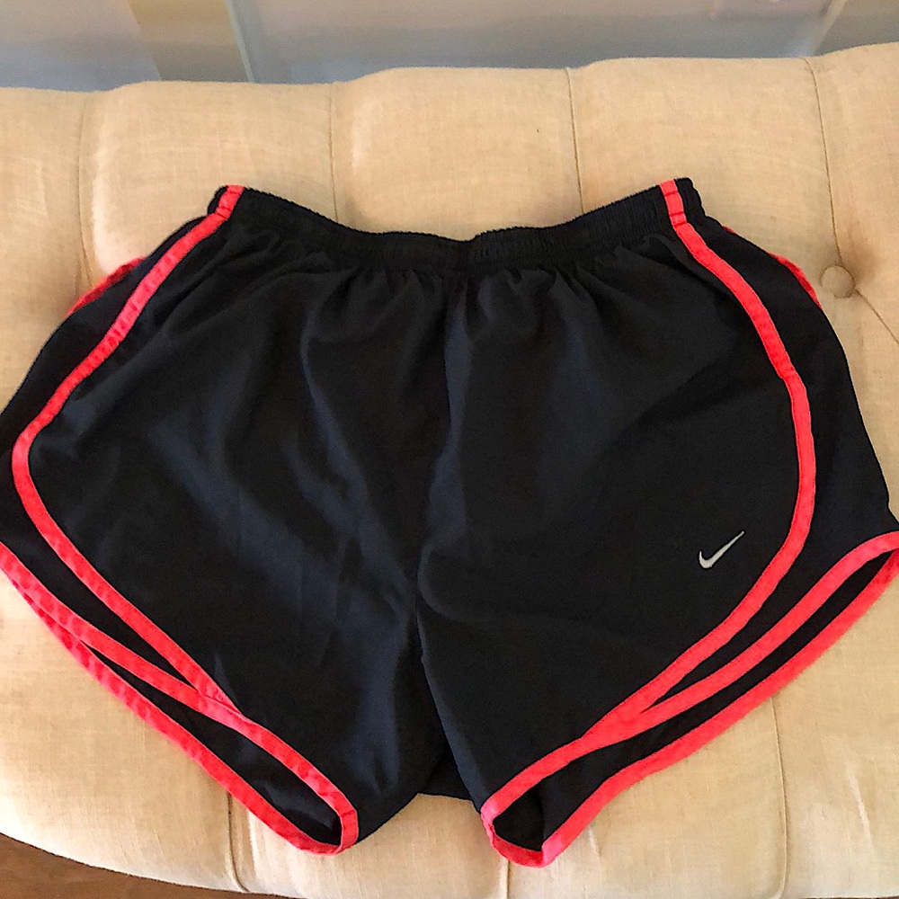 Black Dri-Fit Nike shorts with coral trim